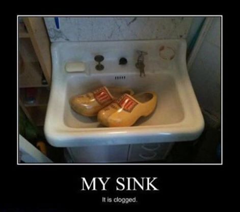 Clogs in a sink with the caption 'The toilet is clogged'